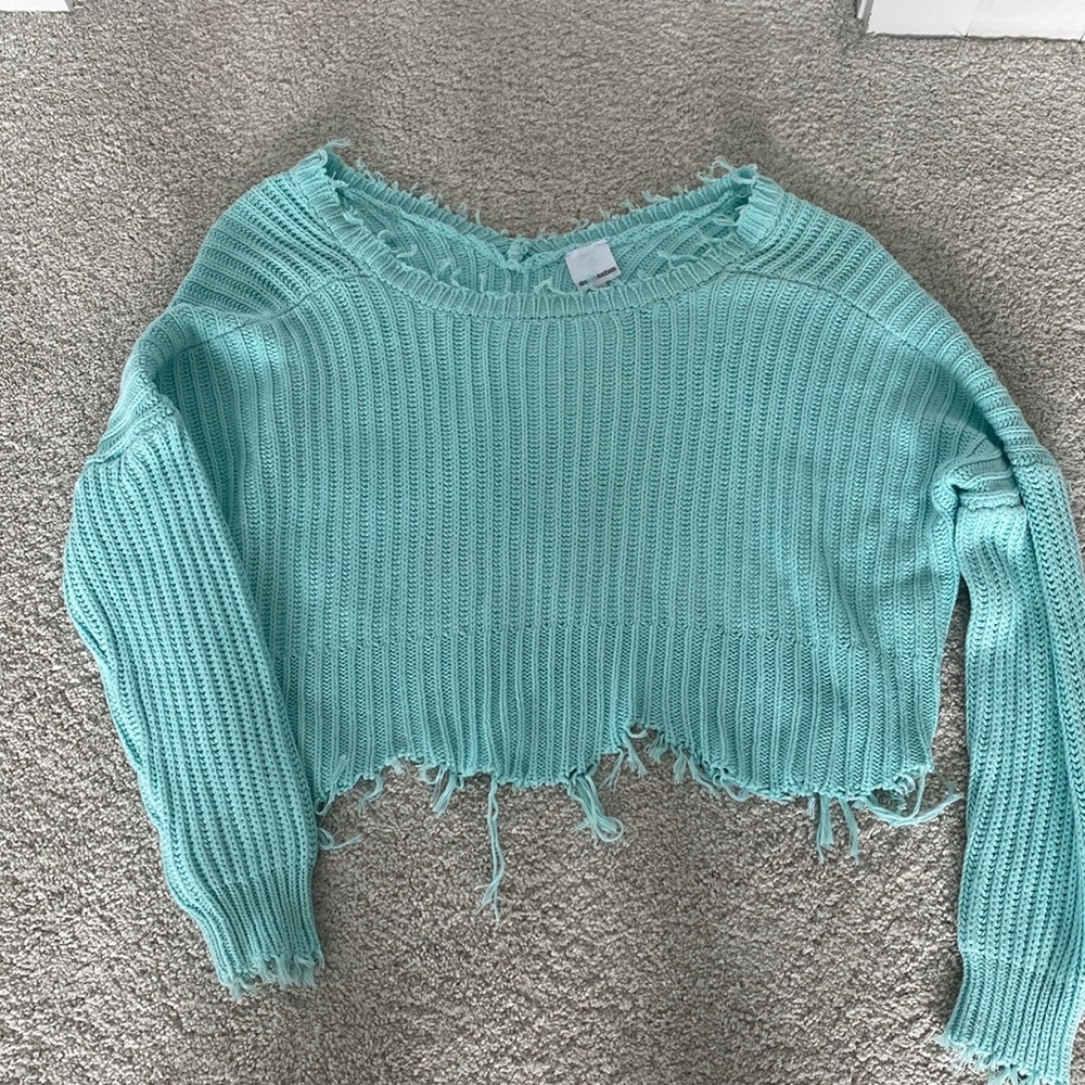 “Ripped” look cropped sweater.